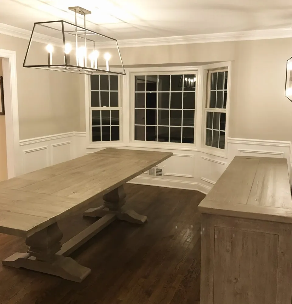Dining room with fresh white wainscoting and trim, painted by Paint Plus in Chatham, NJ